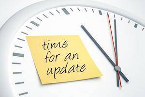 Clock with sticky note: "time for an update"