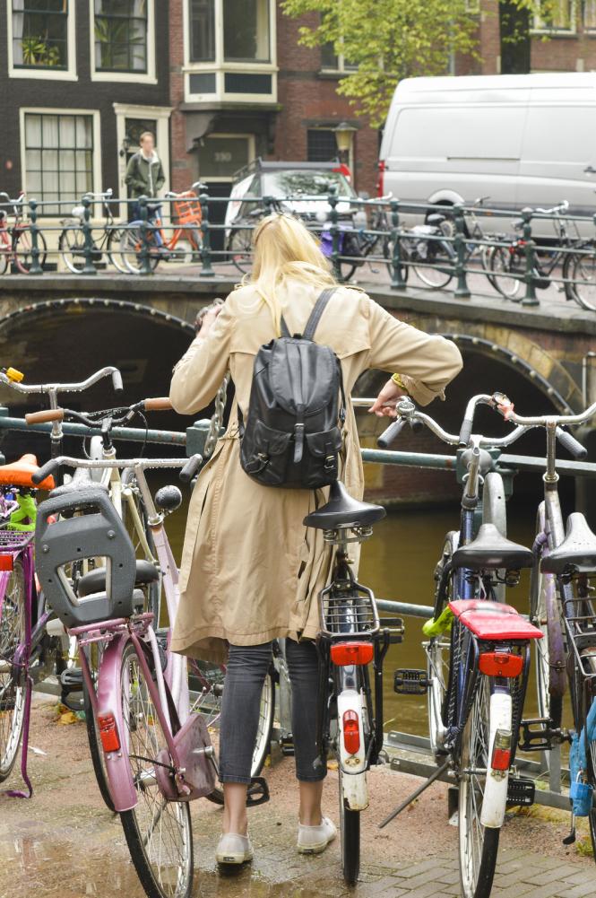 Woman with bicycle in Amsterdam - Gamesforlanguage.com